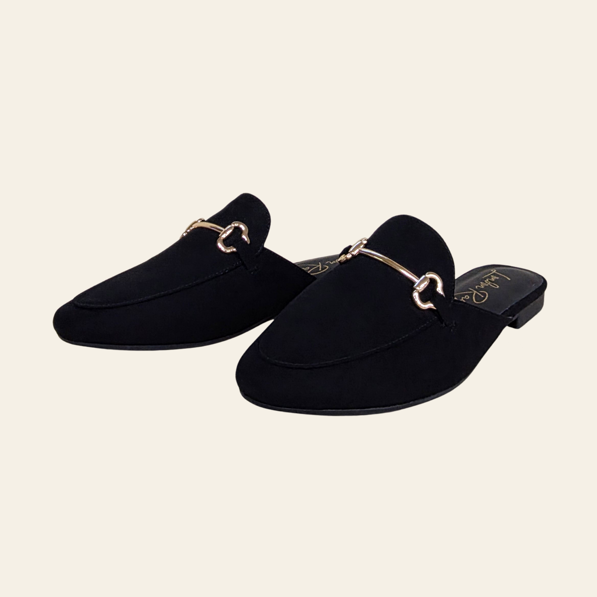 Side view of The Alpine black suede mule loafer