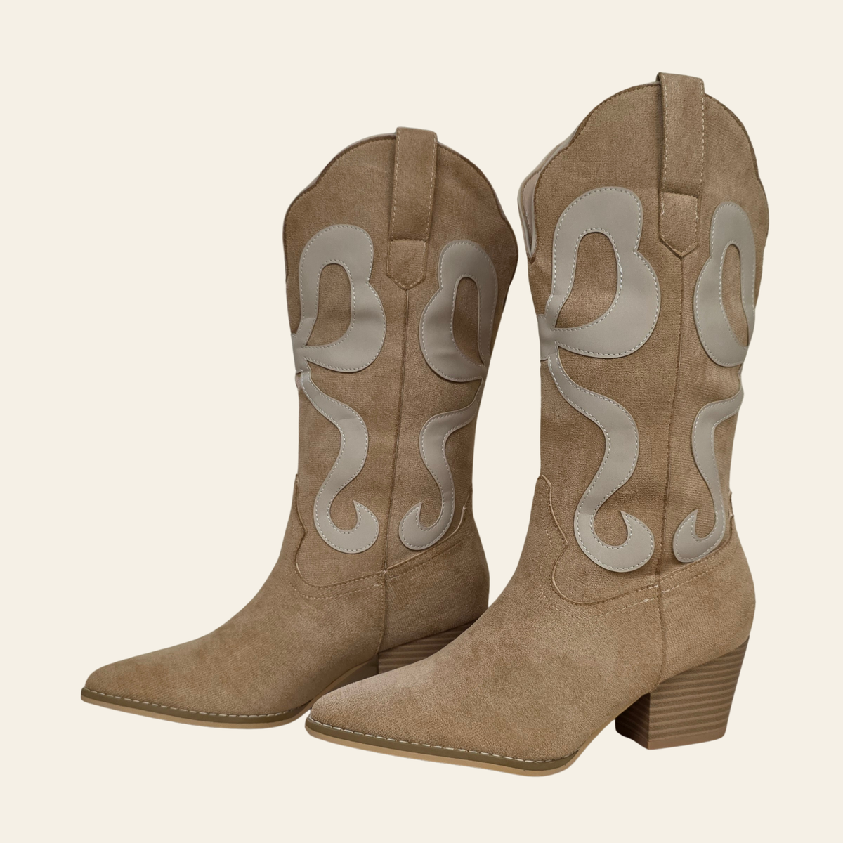 Side view of The Bowie - a western boot with ribbon inlay pointed toe and stacked heel in faux suede