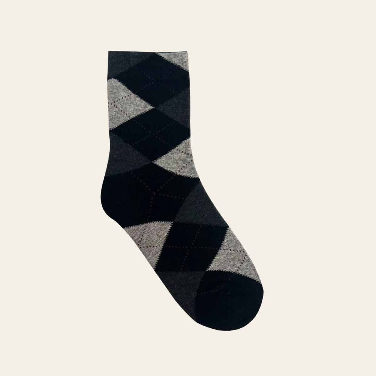 A single crew-length argyle sock in black, charcoal gray, and light gray, shown against a solid off-white background.