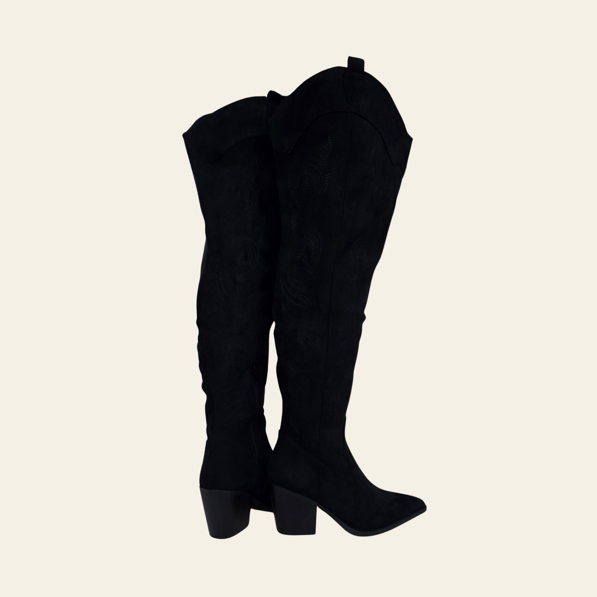 A pair of black over-the-knee boots with a textured finish and block heels, shown from a side profile view against a solid light beige background.
