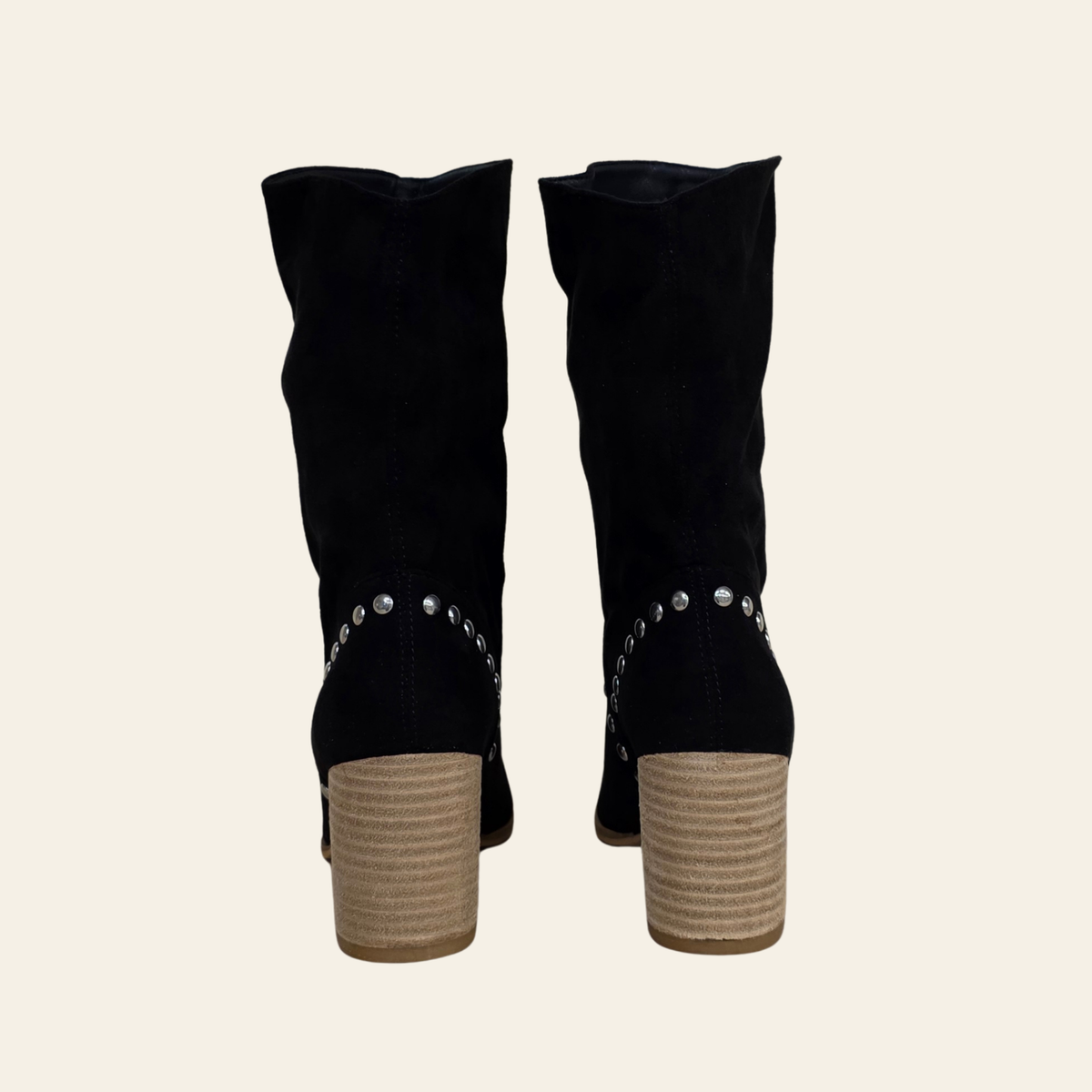 Back view of The Brigitta - faux suede in black with a slouchy slip on style, pointed toe and stacked heel.