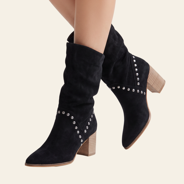 Brigitta - Black faux suede slouchy slip on ankle boots with silver stud embellishments and a stacked wood-look block heel.