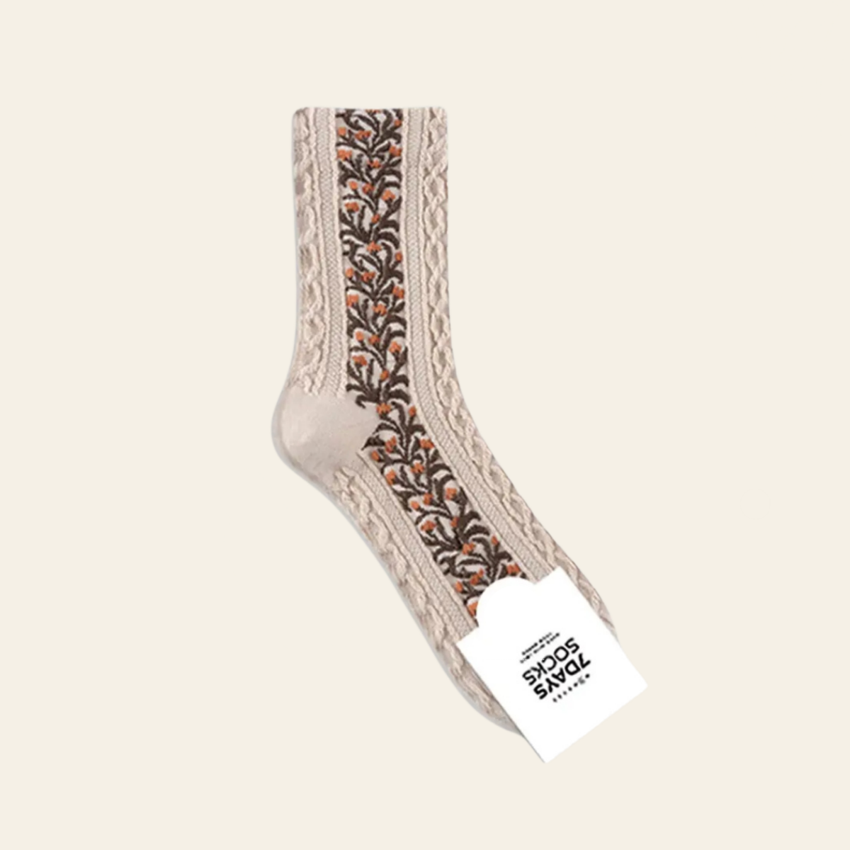 Socks featuring a beige cable-knit  with a central vertical band of brown and orange floral embroidery.