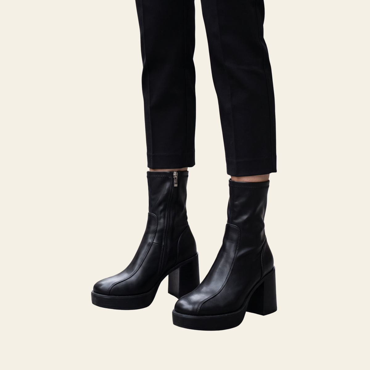 Black faux leather platform boots by Oasis Society.