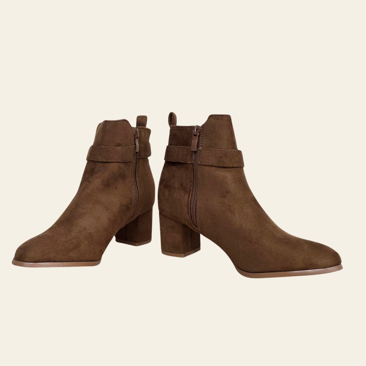 Camel ankle boots on a white background