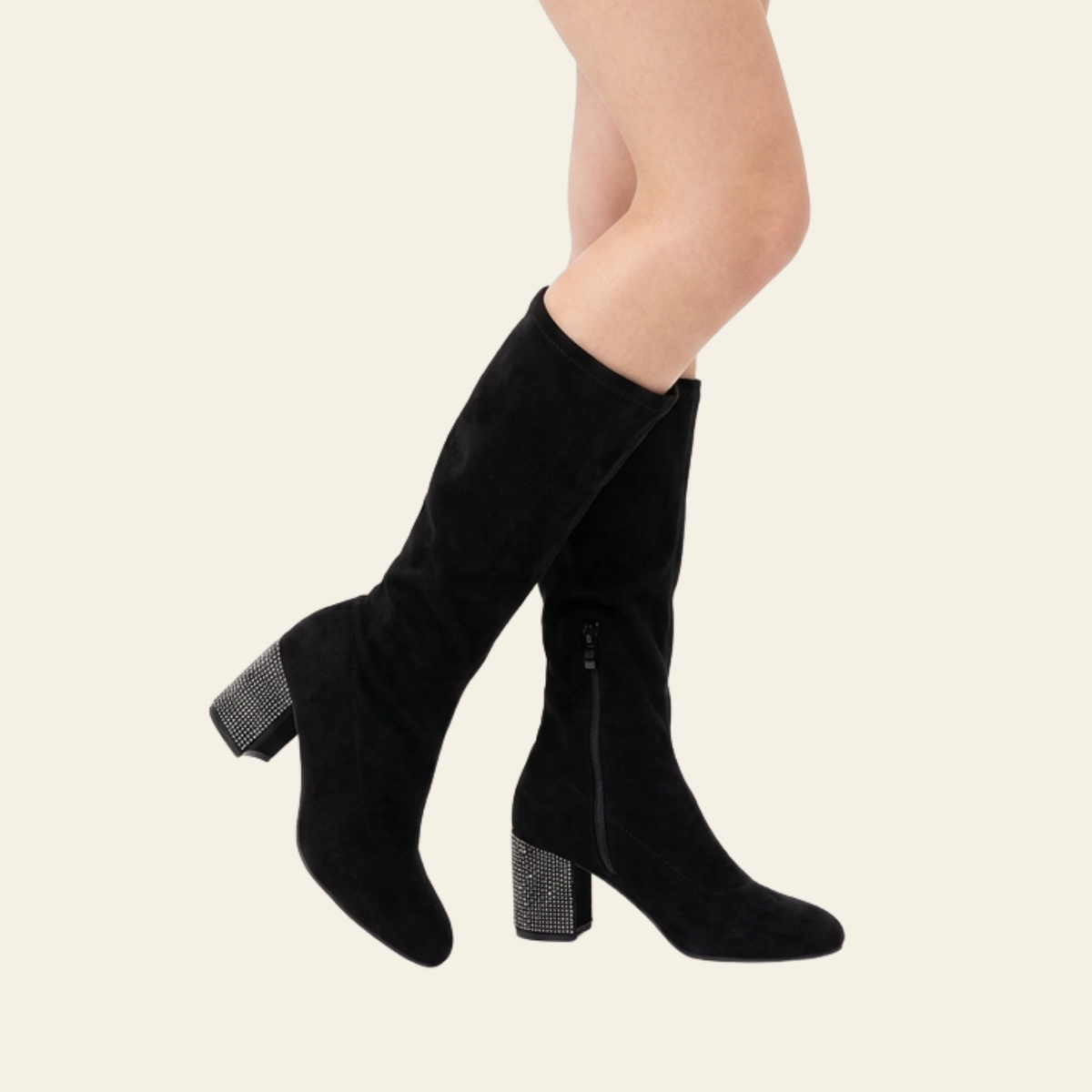 Black ankle boots with platform heels, shown on a model's feet against a light beige background. One boot features a side zipper, and the other has a decorative silver rhinestone fringe detail on the side.