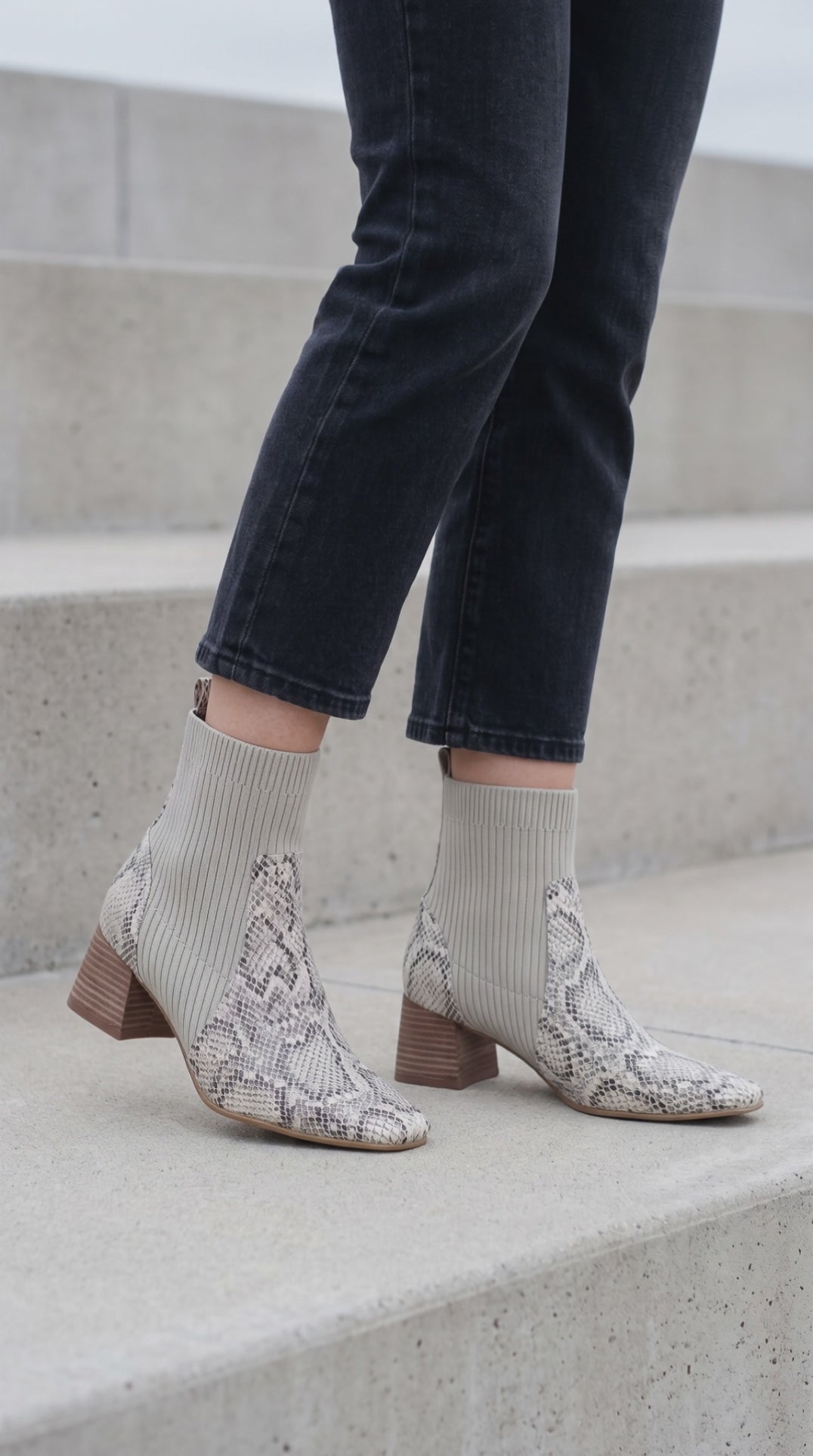 Model on steps with Geraldine Snake Sock  Boot