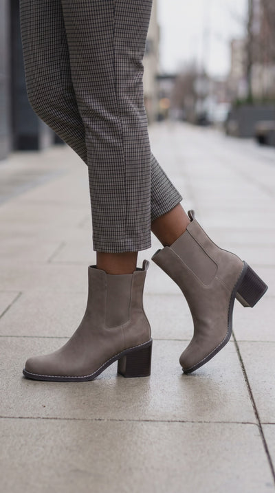 model wearing faux suede chelsea slip on boots