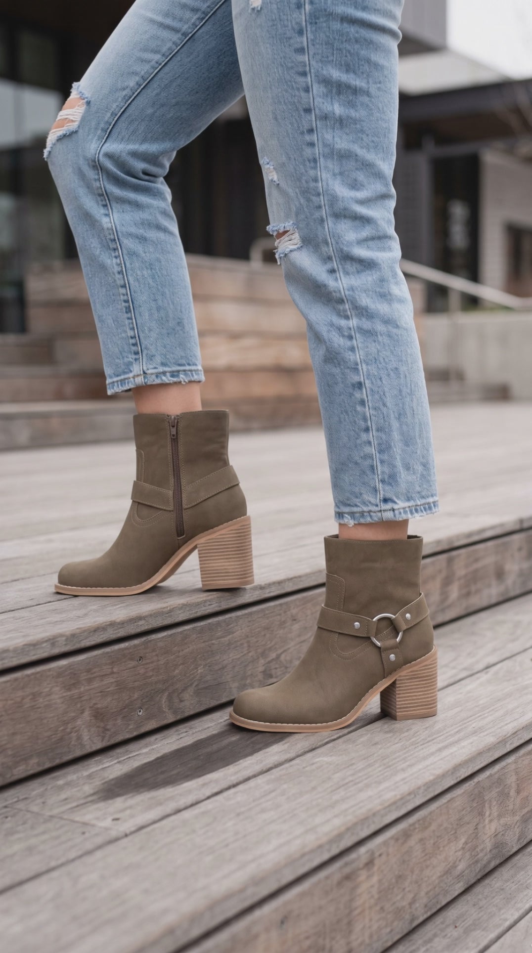 Model going up steps in the Cameron Dark Taupe Moto Chelsea Boot
