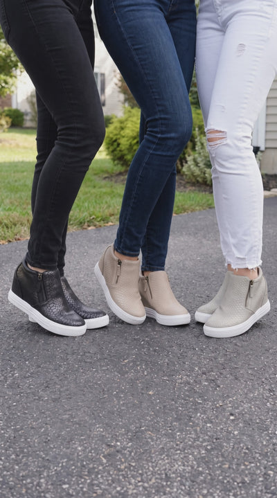 Timmibelle snake sking wedge sneakers shown in black, blush and cream colorways.